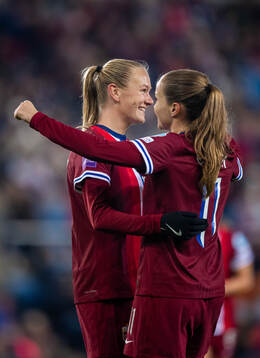 Frida Maanum of Norway celebrates with teammate Guro Reiten