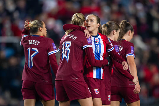 Frida Maanum of Norway celebrates with teammate Guro Reiten
