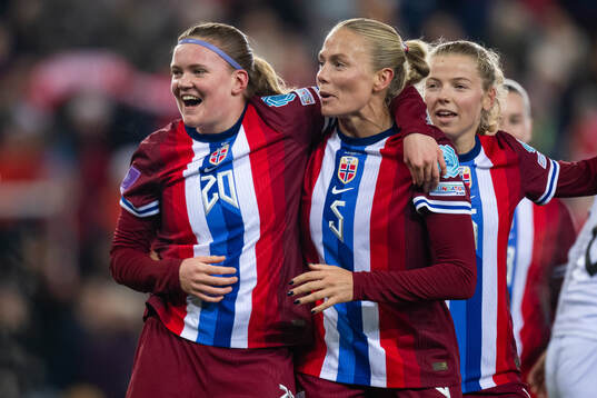Signe Gaupset of Norway celebrates with teammates Guro