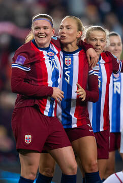 Signe Gaupset of Norway celebrates with teammates Guro