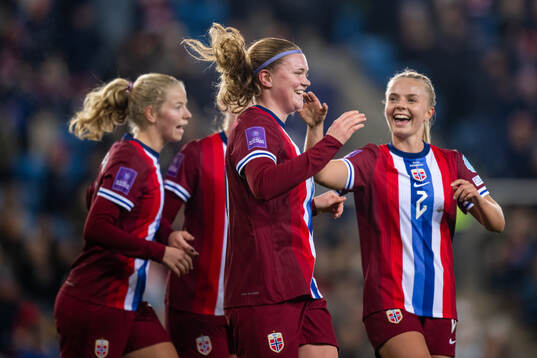 Signe Gaupset of Norway celebrates with teammate Emilie