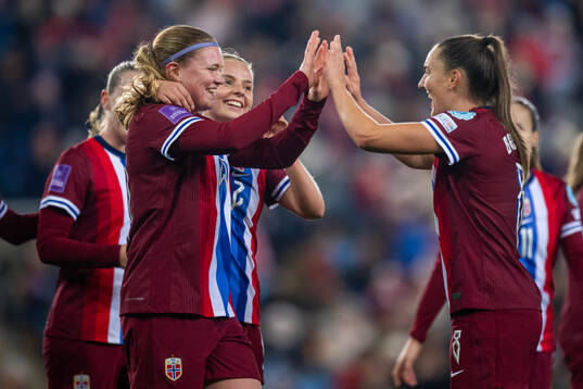 Signe Gaupset of Norway celebrates with teammates Emilie