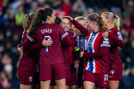 Guro Reiten of Norway celebrates with Ingrid Syrstad Engen