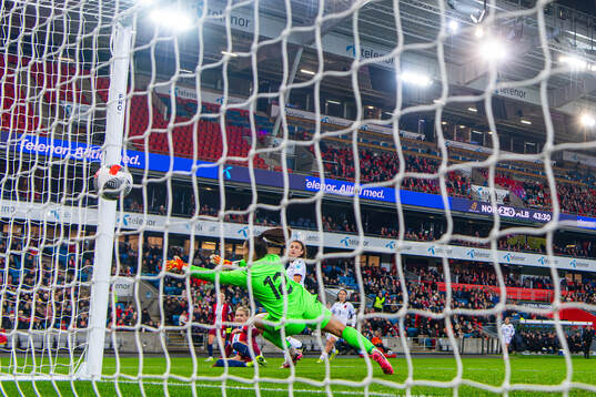Ada Hegerberg of Norway scores the 3-0 goal past goalkeeper