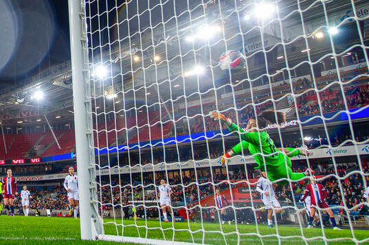 Frida Maanum of Norway scores the 6-0 goal past goalkeeper