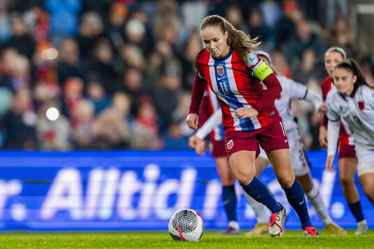 Guro Reiten of Norway scores the 8-0 goal