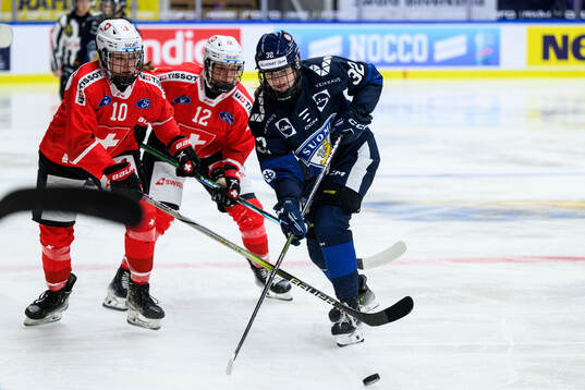 Janine Hauser and Lisa Ruedi of Switzerland and Emilia Vesa