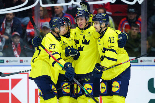 Dennis Rasmussen of Sweden celebrates with team mates