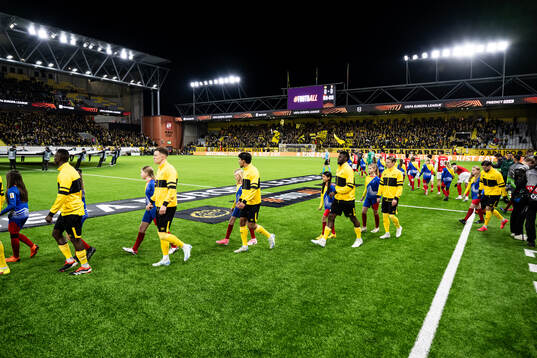 The teams enters the pitch