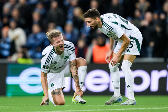 Tin Jedvaj and Filip Mladenovic of Panathinaikos in pain
