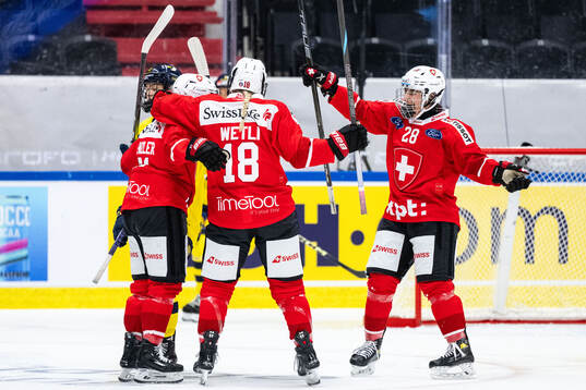 Rahel Enzler of Switzerland celebrates with Stefanie Wetli