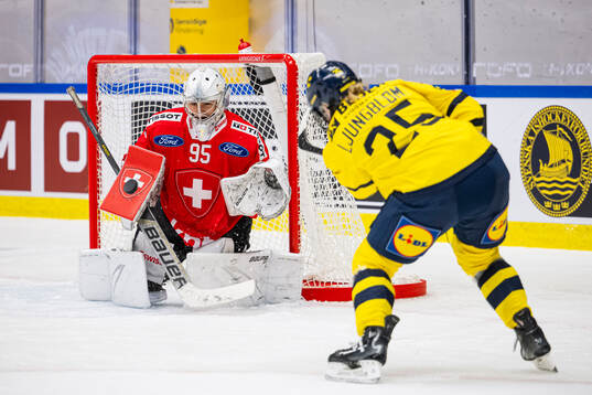 Lina Ljungblom of Sweden and goaltender Talina Benderer of