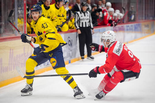 Filip Berglund of Sweden and Tyler Moy of Switzerland