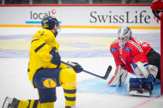 Oskar Lang of Sweden shoots to score 2-1 goal behind Gilles