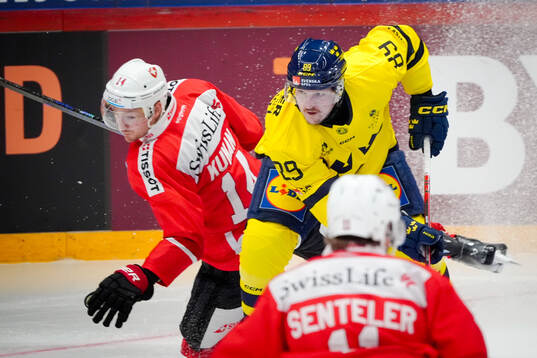 Dean Kukan of Switzerland and Patrik Karlkvist of Sweden