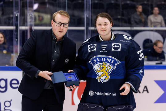 Goaltender Anni Keisala of Finland is awarded best