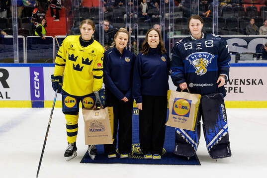 Hanna Thuvik of Sweden and goaltender Anni Keisala of