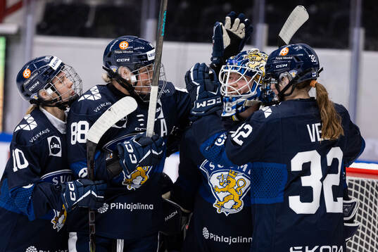 Ronja Savolainen, goaltender Anni Keisala, and Emilia Vesa