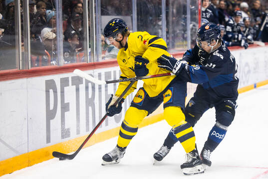Christian Folin of Sweden and Patrik Puistola of Finland