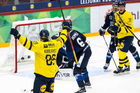 Patrik Karlkvist of Sweden celebrates scoring 4-4