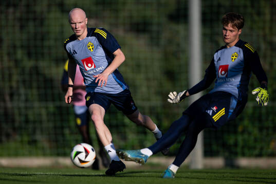 Marcus Rafferty and goalkeeper Filip Sidklev