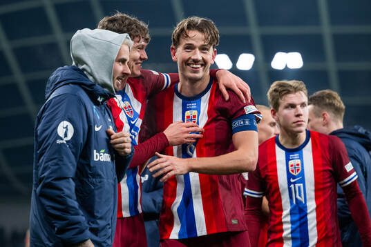Jørgen Strand Larsen and Sander Berge of Norway celebrate