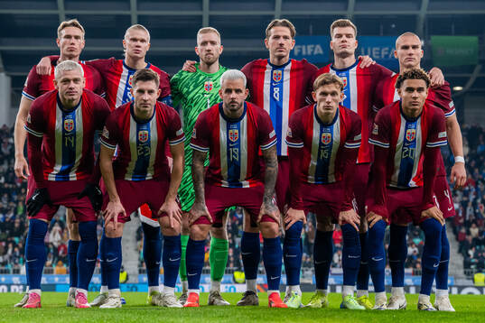 The starting eleven of Norway pose for a team photo