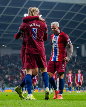 Erling Braut Haaland of Norway celebrates with teammate