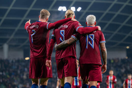 Erling Braut Haaland of Norway celebrates with teammates
