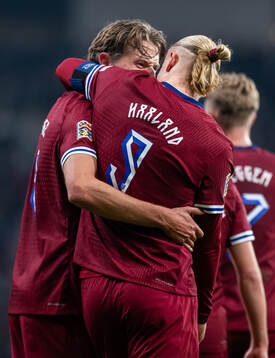 Erling Braut Haaland of Norway celebrates with teammate