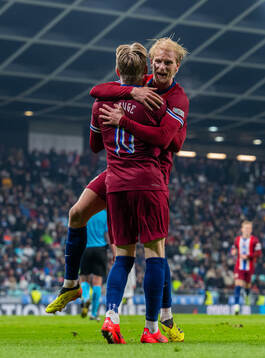 Jens Petter Hauge of Norway celebrates with teammate Morten