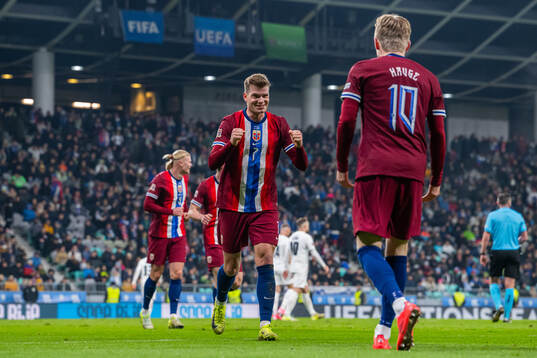 Jens Petter Hauge of Norway celebrates with teammate