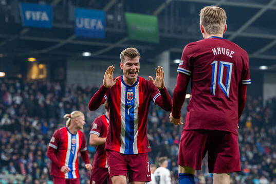 Jens Petter Hauge of Norway celebrates with teammate