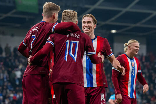 Jens Petter Hauge of Norway celebrates with teammate