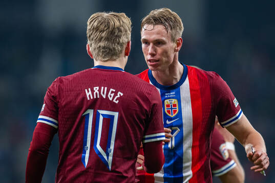 Jens Petter Hauge of Norway celebrates with teammate