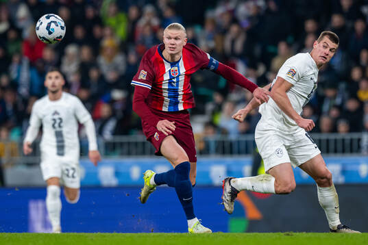 Erling Braut Haaland of Norway and Jaka Bijol of Slovenia