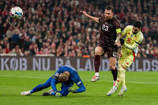 Kasper Schmeichel and Pierre-Emile Højbjerg of Denmark and