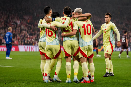 Mikel Oyarzabal of Spain celebrates with team mates
