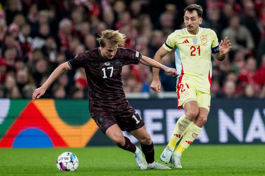 Victor Kristiansen of Denmark and Mikel Oyarzabal of Spain
