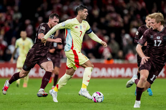 Pierre-Emile Højbjerg of Denmark and Alvaro Morata of Spain