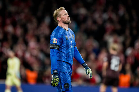 Goalkeeper Kasper Schmeichel of Denmark looks dejected