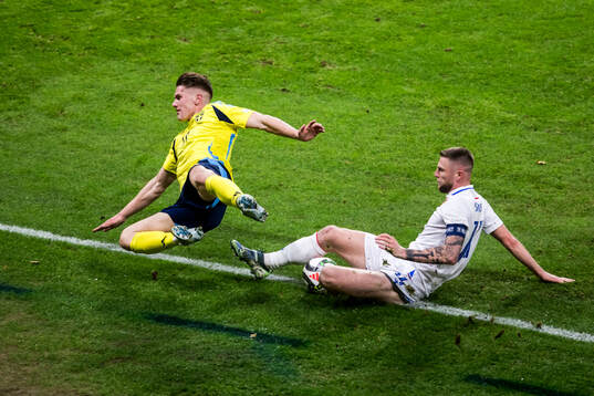 Viktor Gyökeres of Sweden and Milan Skriniar of Slovakia