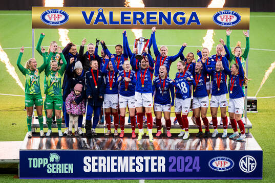 Players of Vålerenga celebrates with the trophy