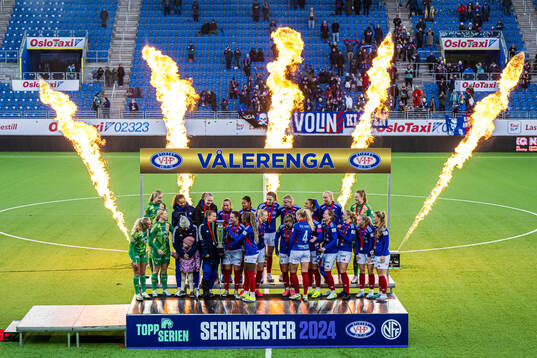 Players of Vålerenga celebrates with the trophy