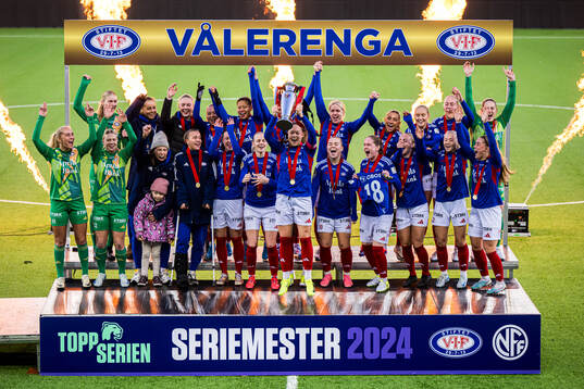 Players of Vålerenga celebrates with the trophy