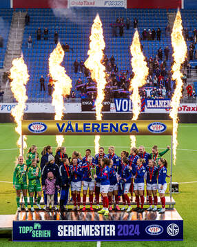 Players of Vålerenga celebrates with the trophy