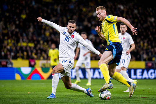David Hancko of Slovakia and Dejan Kulusevski of Sweden
