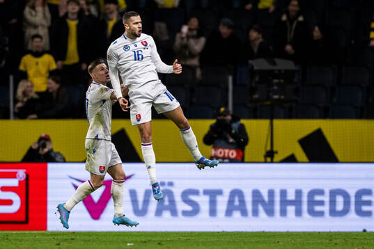 David Hancko of Slovakia celebrates scoring 1-1