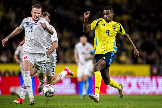 Denis Vavro of Slovakia and Alexander Isak of Sweden