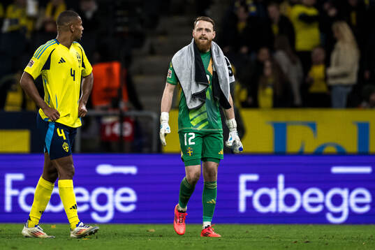 Isak Hien and goalkeeper Viktor Johansson of Sweden looks